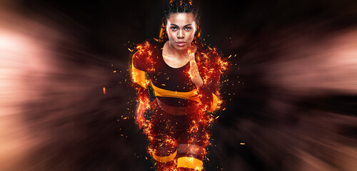 Strong athletic woman sprinter, running on black background wearing in the sportswear. Fitness and...