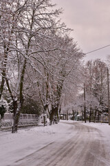 A city street covered in ice and snow on a gloomy winter's day. Snow.