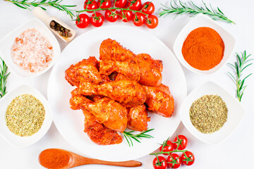 Smoked chicken leg drumsticks with herbs and spices. Raw marinated chicken meat, chicken legs