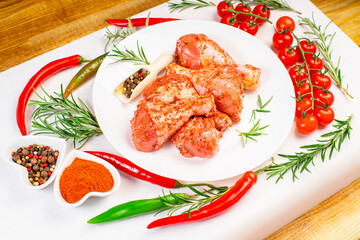 Smoked chicken leg drumsticks with herbs and spices. Raw marinated chicken meat, chicken legs