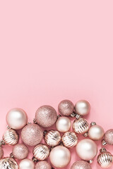 Decorative pink balls on a pink background. Top view, flat lay.