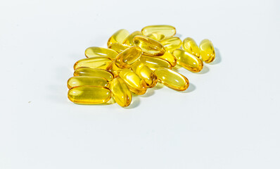 Close up few gel cap pills with oil Omega 3. white background