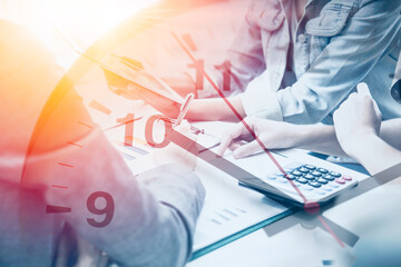 Business Working hours Concept, Office Employee Team Meeting Work Together overlay with Times Clock.