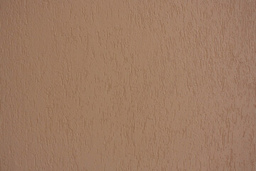 Light brown plaster wall. Light background with texture.
