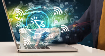 Business hand typing on a modern laptop