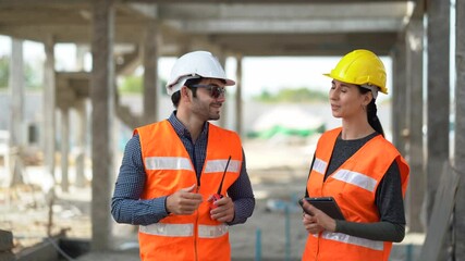 architect man and foreman women discuss with tablet on construction site at village . contractor worker Inspection with builder . Engineer  shaking hands in workshop