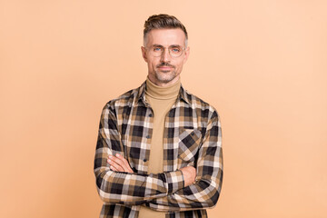 Photo of mature confident man crossed hands eyewear clever manger isolated over beige color background