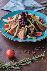 Grilled beef meat salad on wooden table