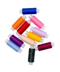 Multicolored coils of thread isolated on a white background.