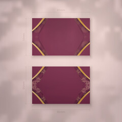 Burgundy business card template with vintage gold ornaments for your brand.
