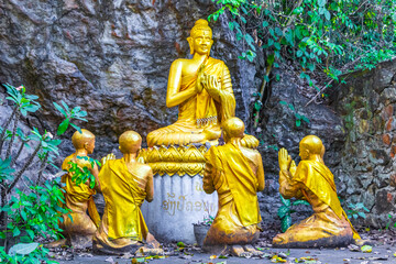 Golden buddha statues Phousi Hill Wat Chom Si Luang Prabang.