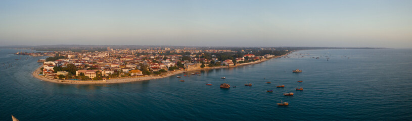 Tropical island of Zanzibar, Tanzania. Coastline, ocean and boats on the shores of Zanzibar city