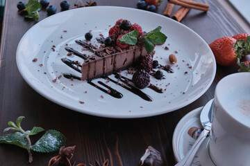 Chocolate cake on white plate