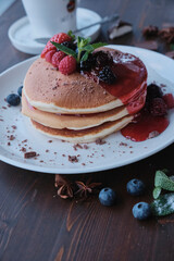 Plate of fresh pancakes with fruits