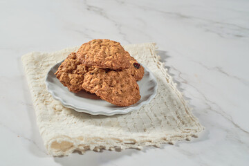 Stack of oatmeal cookies with dates. Healthy dessert concept.