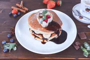 Plate of fresh pancakes with fruits
