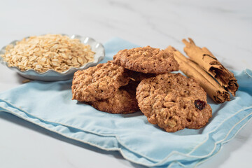 Homemade oatmeal cookies and oat flakes. Healthy dessert concept.