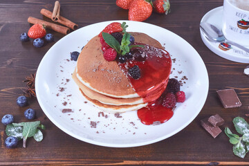 Plate of fresh pancakes with fruits
