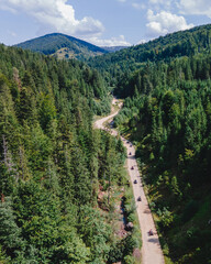 aerial view of quad bike riders at mountain trail road