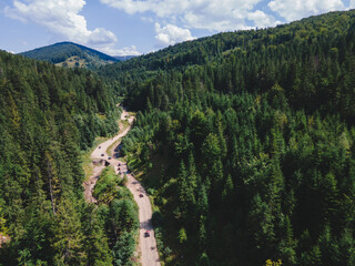 aerial view of quad bike riders at mountain trail road © phpetrunina14