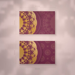 Burgundy business card with mandala gold ornament for your brand.