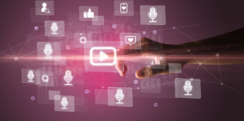 Fototapeta premium Hand pressing social media multimedia application screen with media icons on futuristic concept