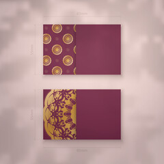 Burgundy business card with mandala gold ornament for your business.