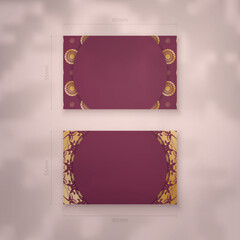 Burgundy business card with mandala gold pattern for your brand.