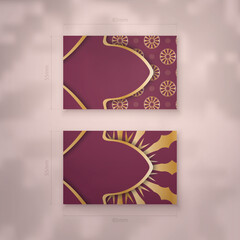 Burgundy business card with mandala gold pattern for your contacts.