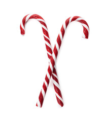 Delicious Christmas candy canes on white background, top view