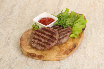 Grilled beef burger cutlet with sauce