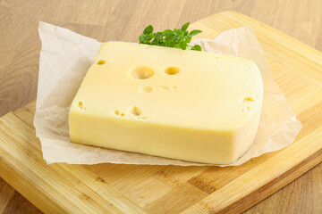 Maasdam cheese over the board