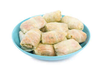 Uncooked stuffed cabbage rolls on white background