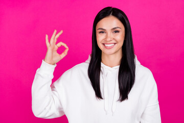 Photo of young cheerful girl show okey symbol approve good nice ad isolated over magenta color background