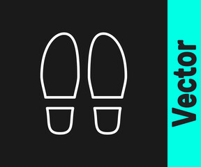 White line Footsteps icon isolated on black background. Detective is investigating. To follow in the footsteps. Vector