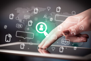 Close-up of a hand using tablet, social media concept