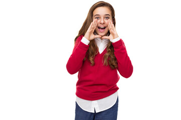 Photo of beautiful cute charming positive brunette teenage girl with long hair in stylish red sweater and white shirt shouts with open mouth isolated on white background with free space for text