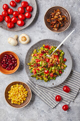 Quinoa with green beans, tomatoes, fried champignons, corn, red bell peppers, peas and soybeans. Healthy Vegetable Mix