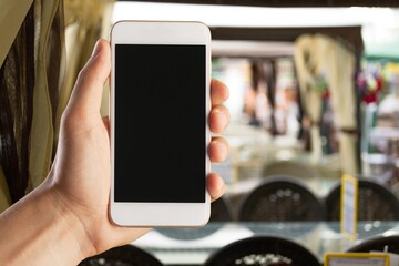 Hand hold a smartphone with a blank screen