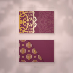 Business card template burgundy color with mandala gold pattern for your business.