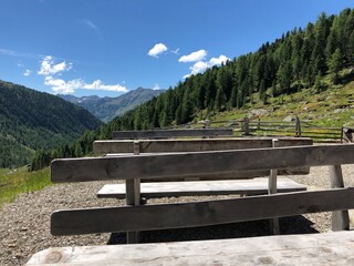 Benches and tables and behind beautiful landscape in Southtyrol 