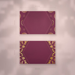 Business card template burgundy with Indian gold ornaments for your personality.