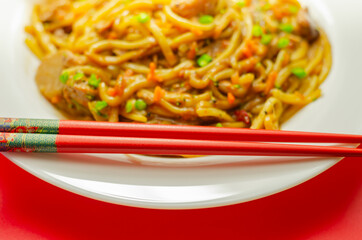 Cooked free range egg noodles with shredded duck in a savoury plum, ginger, chilli and garlic sauce with onions, carrots, pak choi, water chestnuts