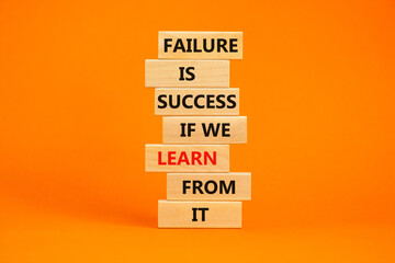 Failure or success symbol. Wooden blocks with words Failure is success if we learn from it....