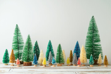 Christmas and New Year pine tree decoration on wooden table over white background.