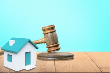 Gavel wooden and house for home buying or selling of bidding or lawyer, real estate and building concept.