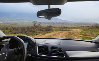 View from the Car to the Dirt Winding Road