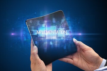 Businessman holding a foldable smartphone