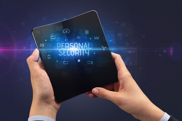 Businessman holding a foldable smartphone, security concept