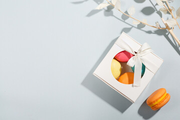 macarons in gift box mockup on a blue background